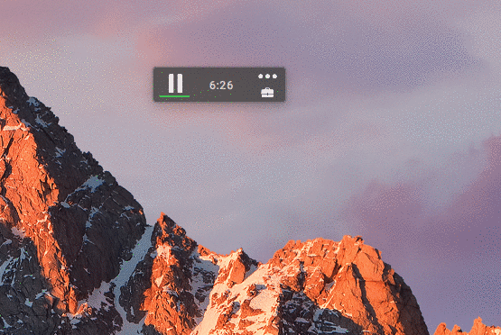 Snow-capped mountain peaks illuminated by golden sunrise light against a purple twilight sky.